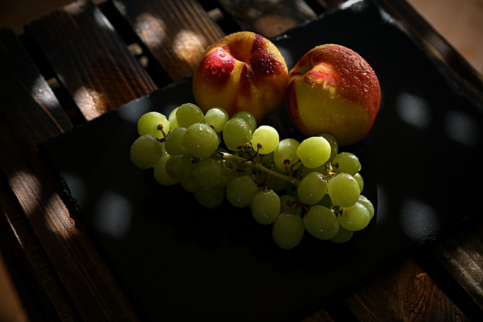 green grapes on black tray